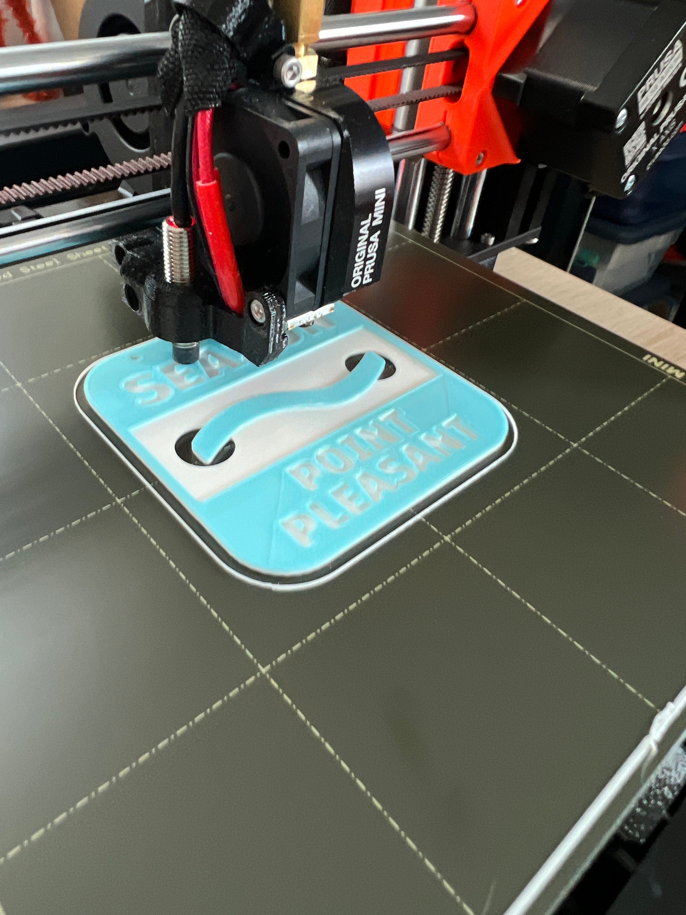 Jersey Shore beach badge ornament being 3D printed on the printer bed